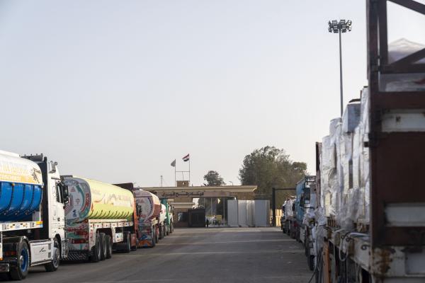 Humanitarian aid trucks wait for Israeli approval to enter the Gaza Strip on the Egyptian side of the Rafah Crossing.