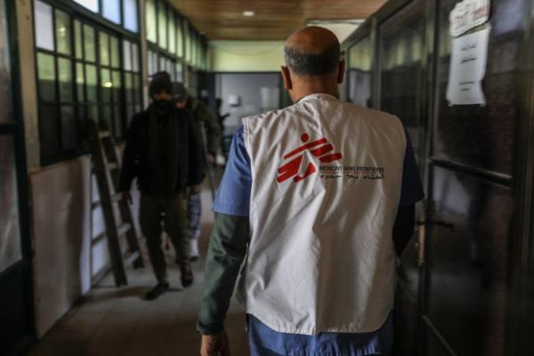 A doctor wearing a Doctors Without Borders (MSF) vest walks through the halls of the Nasser Medical Complex in Khan Yunis.