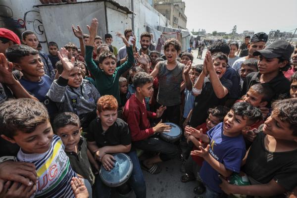 Children in Gaza City celebrate the announcement of a ceasefire agreement in October 2025.