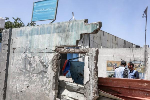 Image of the damaged facade of an UNRWA distribution center in the Nuseirat Refugee Camp. May 2024.