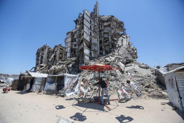 Children celebrate Eid al-Adha in Gaza City amid the rubble.