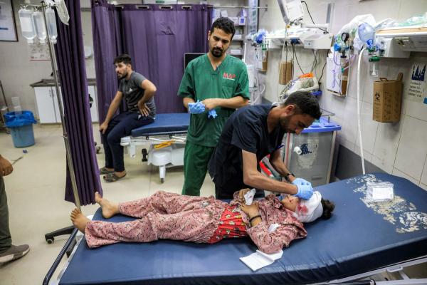 A child, who sustained injuries to the head, is treated by medical staff after an Israeli airstrike on Mawasi, Khan Yunis in the Gaza Strip. July 7, 2026.