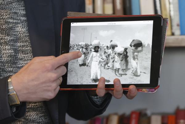 Israeli historian and Akevot researcher Adam Raz points to an image of the Nakba hosted on the Israeli government archives website.