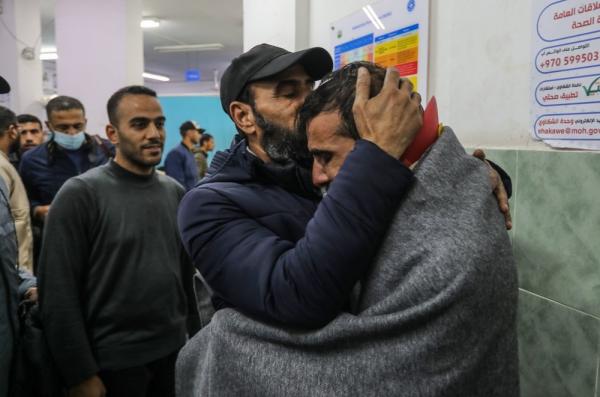 Palestinians kidnapped by the Israeli mliitary from the Bureij refugee camp and Khan Yunis during Israel's assault on the central Gaza Strip return home and are greeted by loved ones after captivity in Israeli prison.