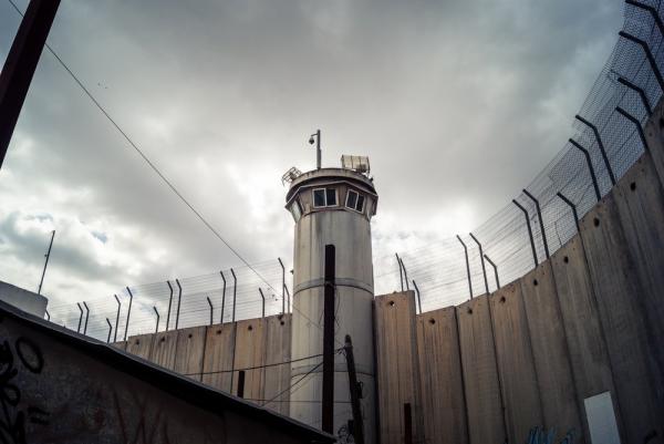 A view of an Israeli military watchtower and the apartheid wall in the West Bank.