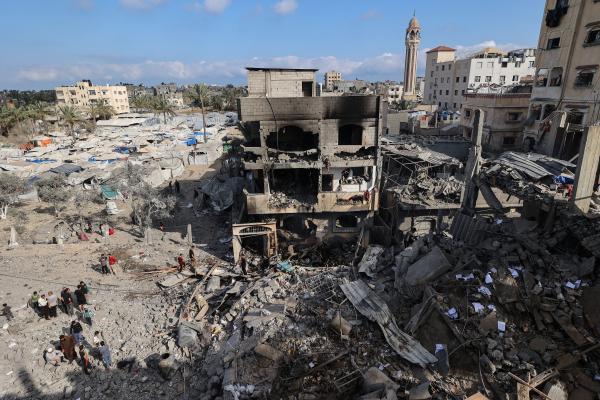 Aftermath of an Israeli airstrike on a building in Deir al-Balah in the central Gaza Strip, with many displacement tents in the background, on May 24, 2026. 