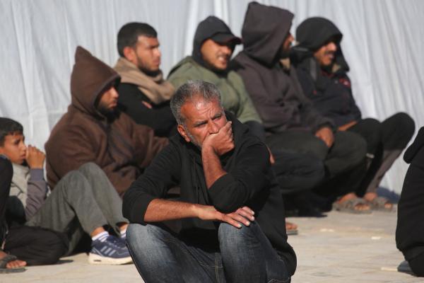 Palestinian mourners sit outside of Nasser Hospital in Khan Yunis the day after an Israeli airrstrike. April 10, 2026.