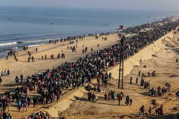 Masses of Palestinians walk home to northern Gaza along the Mediterranean shoreline following the short-lived January 2025 Gaza ceasefire.