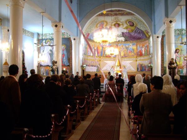 Interior view of Gaza City's Holy Family Church as a religious ceremony is underway.
