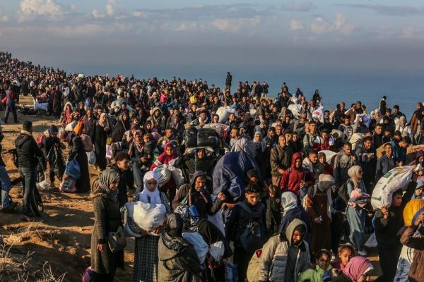 Masses of displaced Palestinians walk home to northern Gaza after the enactment of the short-lived January 2025 Gaza ceasefire.