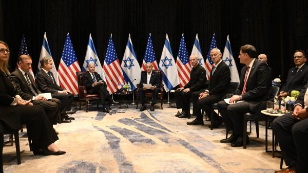 National Security Advisor Jake Sullivan (2nd L), US Secretary of State Antony Blinken (3rd L) and US President Joe Biden (4th L) listen to Israel's Prime Minister Benjamin Netanyahu (top R-C) as they join a meeting of the Israeli war cabinet in Tel Aviv on October 18, 2023