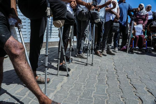 Palestinian patients and wounded people gather outside Nasser Hospital during a demonstration demanding permission to leave the Gaza Strip for medical treatment abroad, in Khan Yunis, Gaza, Palestine on August 30, 2026. 